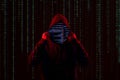 Silhouette of anonymous hacker and digital binary code. Cyber attack concept Royalty Free Stock Photo