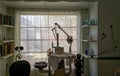 Silhouette of an antique dentist`s chair in front of a bright window near Bishop, California, USA - November 6, 2022