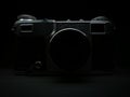 Silhouette of antique obsolete russian or soviet professional dslr camera with film from ussr, retro photography equipment in