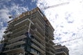 Silhouette of the apartment construction in the construction site in back lit