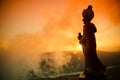 Silhouette of Arab man stands alone in the desert and watching the sunset with clouds of fog. Eastern Fairytale Royalty Free Stock Photo