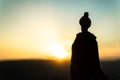 Silhouette of Arab man stands alone in the desert and watching the sunset with clouds of fog. Eastern Fairytale Royalty Free Stock Photo