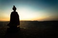 Silhouette of Arab man stands alone in the desert and watching the sunset with clouds of fog. Eastern Fairytale Royalty Free Stock Photo