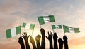 Silhouette of arms raised waving a Nigeria flag with pride. 3D Rendering Royalty Free Stock Photo