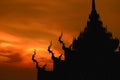 silhouette art on roof Buddhist temple and sunset sky Royalty Free Stock Photo