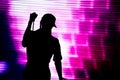 Silhouette of an artist singing live on the stage Royalty Free Stock Photo
