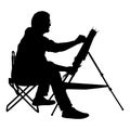 Silhouette, artist at work on a white background