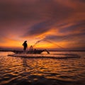 Silhouette of asian fisherman on wooden boat in action Royalty Free Stock Photo