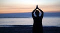 Silhouette Asian senior woman doing yoga at morning beach Royalty Free Stock Photo