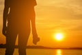 Silhouette of Asian women holding a camera shooting in nature Royalty Free Stock Photo