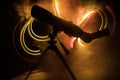 Silhouette of a astronomy telescope on dark foggy backlight