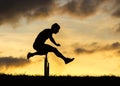 Silhouette of an athlete in hurdling Royalty Free Stock Photo