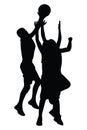 Silhouette of athletic basketball players jumping to score a shot