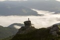 Silhouette of athletic climber tourist on high rocky formation o