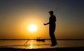 Silhouette Of Athletic Running On The Sunrise Beach