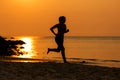 Silhouette athletic woman jogging exercise and relax and freedom on sand beach.