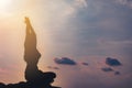 silhouette Athletic woman practice yoga lotus pose to meditation summer vacation on pier with sunset sea beach