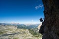 Silhouette of an attractive female climber on a steep Via Ferrata in the Italian Dolomites Royalty Free Stock Photo