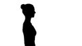 Silhouette Attractive woman in sport ware walking smiling.