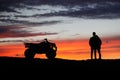 Silhouette ATV or Quad bike in the sunset. Holiday exploration concept