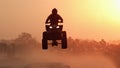 Silhouette ATV or Quad bikes Jump in the sunset. Royalty Free Stock Photo
