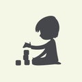 Silhouette of Baby Boy playing with toy blocks. Can be used as logo or sign. Vector Black and white illustration Royalty Free Stock Photo
