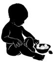 Silhouette baby eats strawberry