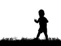 Silhouette of a baby walking on grass, isolated