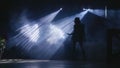 Silhouette of woman dancing in the dark