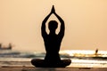 Silhouette Back of views woman practice yoga lotus pose to meditation with summer vacation on the beach