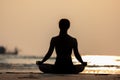 Silhouette Back of views woman practice yoga lotus pose to meditation with summer vacation on the beach Royalty Free Stock Photo