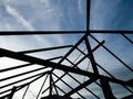 Silhouette background with blue sky, Structure of steel roof frame for building roof construction Royalty Free Stock Photo