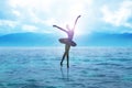 Silhouette of a ballerina dancing on water