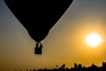 Silhouette balloon floating in the air with the light of the evening sun.