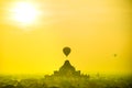 Silhouette balloon over a pagoda field
