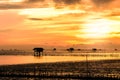 Silhouette of bamboo cottage with morning sunshine in gulf of Thailand Royalty Free Stock Photo