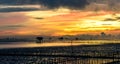 Silhouette of bamboo cottage with morning sunshine in gulf of Thailand Royalty Free Stock Photo