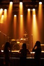 Silhouette, band and playing at stage for concert, spotlight and instruments for music festival. Musician, singing and Royalty Free Stock Photo