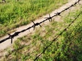 Silhouette barbed wire fence between the soil and grassland Royalty Free Stock Photo