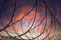 Silhouette of a barbed wire fence steel jail