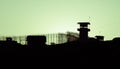 Silhouette of barbed wires and watchtower of prison