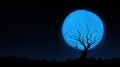A silhouette of a barren tree against a bright blue moon in a dark sky Royalty Free Stock Photo