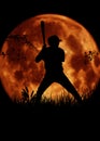 Silhouette baseball player big moon