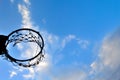 Silhouette of basketball hoop and clouds in blue sky Royalty Free Stock Photo