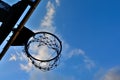 Silhouette of basketball hoop and clouds in blue sky Royalty Free Stock Photo