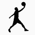 Silhouette of basketball player jumping with ball. Royalty Free Stock Photo