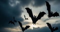 Silhouette of bats flying against a dramatic sky at dusk Royalty Free Stock Photo