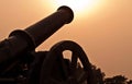 Silhouette of Battle Cannon Firing Towards the Sun