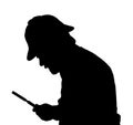 Silhouette of bearded man investigating with a magnifying glass