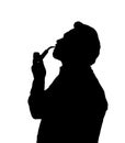 Silhouette of bearded man smoking pipe looking up Royalty Free Stock Photo